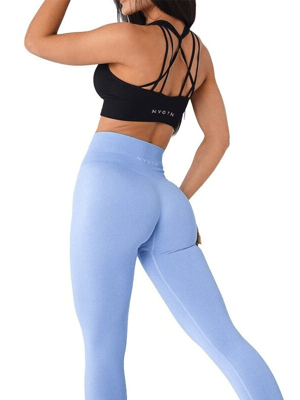 Woman wearing tight elastic blue sports leggings for fitness, showing the high waist and full-length fit, perfect for yoga and running.